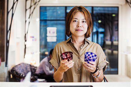Saleswoman in a shop selling Edo Kiriko cut glass in Tokyo, Japan. Stock Photo - Premium Royalty-Free, Code: 6118-08761989
