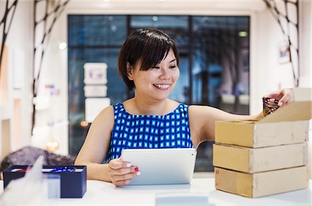 simsearch:6118-09079262,k - Saleswoman in a shop selling Edo Kiriko cut glass in Tokyo, Japan. Stock Photo - Premium Royalty-Free, Code: 6118-08762006