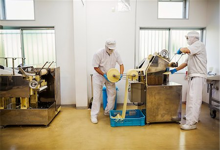 simsearch:6118-08762022,k - A Soba noodle factory.  Sheets of fresh noodle dough being passed through a large pressing machine. Foto de stock - Sin royalties Premium, Código: 6118-08762021