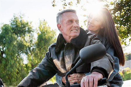 female motorcycle - Senior couple taking a ride on a motorcycle. Stock Photo - Premium Royalty-Free, Code: 6118-08725788