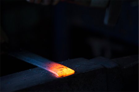 simsearch:6118-08729041,k - A length of metal, one end red hot and resting on an anvil. Stock Photo - Premium Royalty-Free, Code: 6118-08729053