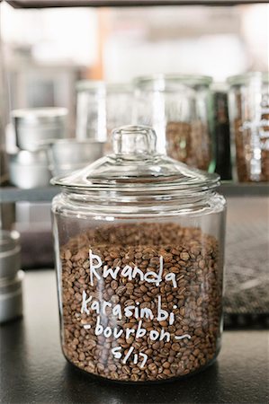 Close up of a glass jar of Rwandan coffee beans. Stock Photo - Premium Royalty-Free, Code: 6118-08729123