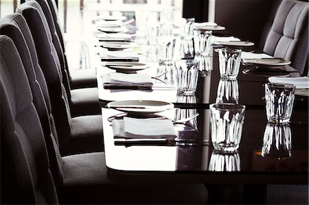 fine dining - Close up of dining tables set with glasses, plates, cutlery and napkins in a restaurant. Stock Photo - Premium Royalty-Free, Code: 6118-08729225