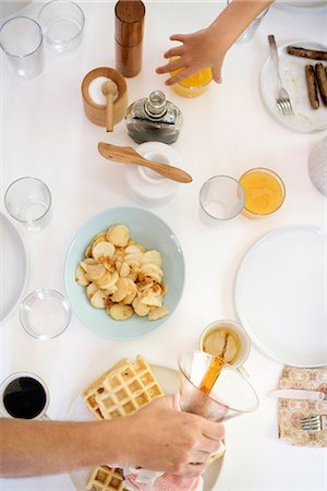 simsearch:6118-08729292,k - High angle view of a breakfast table, waffles, fried potatoes, coffee and juice. Stockbilder - Premium RF Lizenzfrei, Bildnummer: 6118-08729302