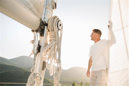 simsearch:6118-07352544,k - Portrait of a blond man on a sail boat. Stock Photo - Premium Royalty-Free, Code: 6118-08729442