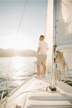 simsearch:6118-07352544,k - Portrait of a blond man on a sail boat. Stock Photo - Premium Royalty-Free, Code: 6118-08729436