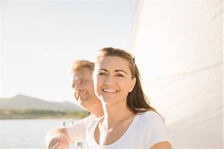 simsearch:6118-07352544,k - Man and woman on a sail boat. Stock Photo - Premium Royalty-Free, Code: 6118-08729438