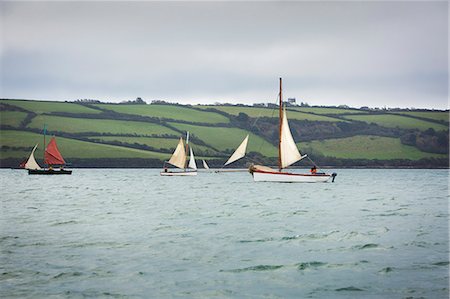 Traditional sailing boats off the coast of the estuary on the River Fal, Falmouth, Cornwall Foto de stock - Sin royalties Premium, Código: 6118-08842109