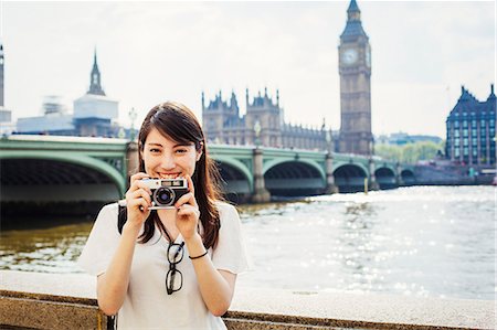 simsearch:614-06898526,k - Young Japanese woman enjoying a day out in London, standing on the Queen's Walk by the River Thames. Stock Photo - Premium Royalty-Free, Code: 6118-08827434