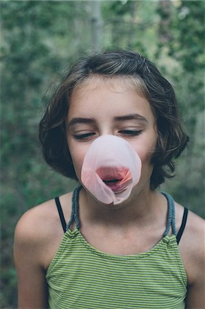 Eleven year old girl blowing bubble gum bubble Stock Photo - Premium Royalty-Free, Code: 6118-08827606