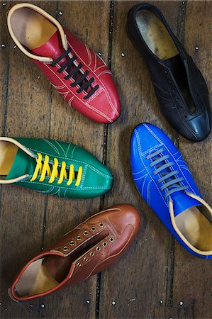 High angle view of colourful leather shoes in a shoemaker's workshop. Stock Photo - Premium Royalty-Free, Code: 6118-08947644