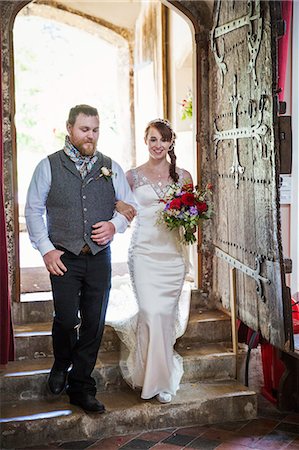 simsearch:6118-08947762,k - Smiling bride and groom entering church. Stockbilder - Premium RF Lizenzfrei, Bildnummer: 6118-08947776