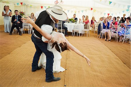 simsearch:6118-07521749,k - Bride and groom dancing together inside a marquee. Photographie de stock - Premium Libres de Droits, Code: 6118-08947789