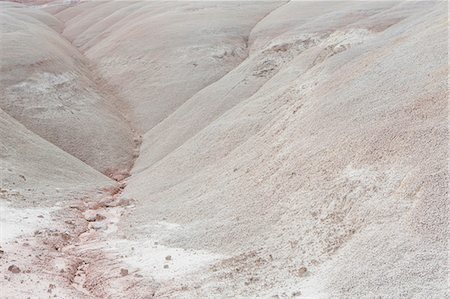 simsearch:6118-08827547,k - Rolling hills of Mancos Shale, Capitol Reef National Park Fotografie stock - Premium Royalty-Free, Codice: 6118-08947861