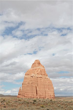 simsearch:614-07234805,k - The Temple of the Moon rock formation in Cathedral Valley in the Capitol Reef National Park, monolith of earthy, buff-pink Entrada Sandstone rising from the plain. Stock Photo - Premium Royalty-Free, Code: 6118-08947914