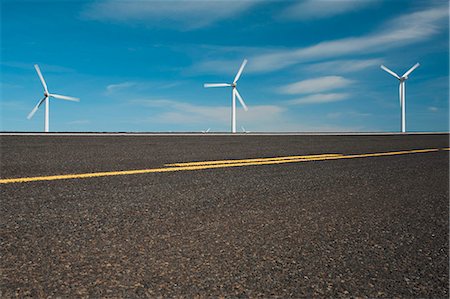 simsearch:6119-07944037,k - Three wind turbines on the horizon and a road running through the plains near the Columbia River Gorge. Stock Photo - Premium Royalty-Free, Code: 6118-08971313