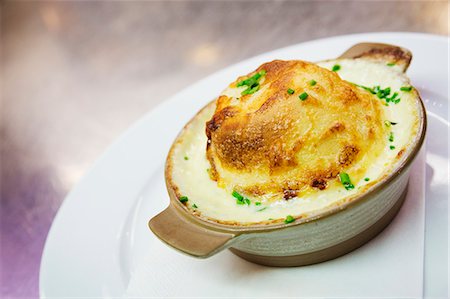 simsearch:6118-08947769,k - Close up of a cheese souffle in a ramekin. Stock Photo - Premium Royalty-Free, Code: 6118-08971594