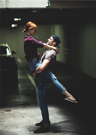 simsearch:693-03474515,k - A couple dancing in an underground parking lot. Photographie de stock - Premium Libres de Droits, Code: 6118-08991383