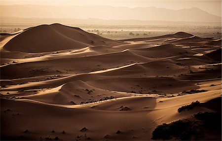 simsearch:6118-08313763,k - Desert landscape with caravan walking across sand dunes, a plain in the distance. Stock Photo - Premium Royalty-Free, Code: 6118-08991562