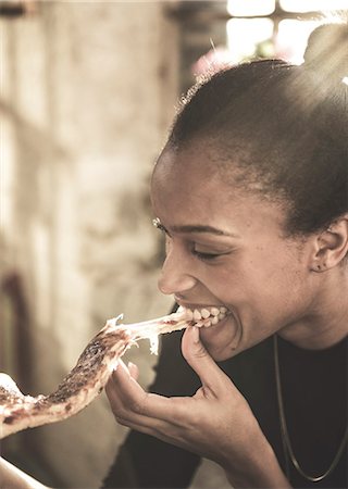 simsearch:6118-09039238,k - Close up of young woman eating slice of pizza. Stock Photo - Premium Royalty-Free, Code: 6118-08991579