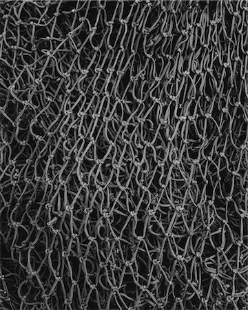 rope closeup - Close up of a grey commercial fishing nets. Foto de stock - Sin royalties Premium, Código: 6118-08910522