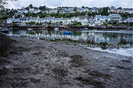 simsearch:6113-07242277,k - A small sheltered harbour and mooring for boats. Houses on the hillside overlooking the bay, and lights at dusk. Stock Photo - Premium Royalty-Free, Code: 6118-09059463