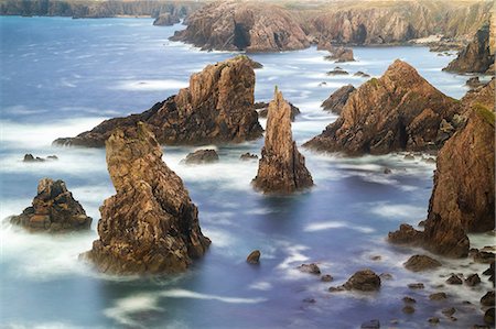 simsearch:6118-09076695,k - Aerial view of coastline with spiky rock formations. Photographie de stock - Premium Libres de Droits, Code: 6118-09076515