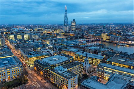 Aerial view of London, UK in the evening, with river Thames and the Shard in the distance. Stock Photo - Premium Royalty-Free, Code: 6118-09076616