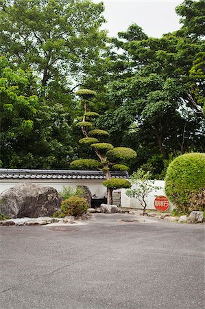 stone and garden - Garden of a Japanese Buddhist temple with rocks and trees. Stock Photo - Premium Royalty-Free, Code: 6118-09079390