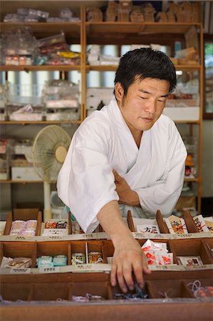 Salesman wearing white kimono at Shinto Sakurai Shrine, Fukuoka, Japan. Stock Photo - Premium Royalty-Free, Code: 6118-09079578