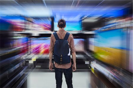 A tourist in a supermarket, a Caucasian man in Tokyo looking around. Stock Photo - Premium Royalty-Free, Code: 6118-09079753