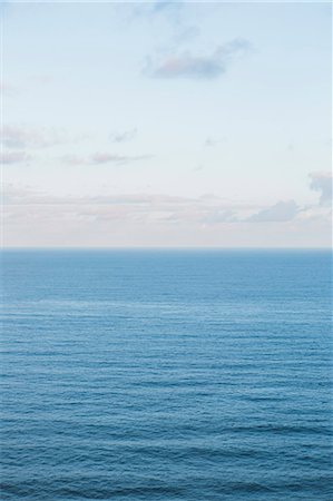 View from the land over the ocean, to the horizon. Open space, seascape and skyscape. Stock Photo - Premium Royalty-Free, Code: 6118-09018271