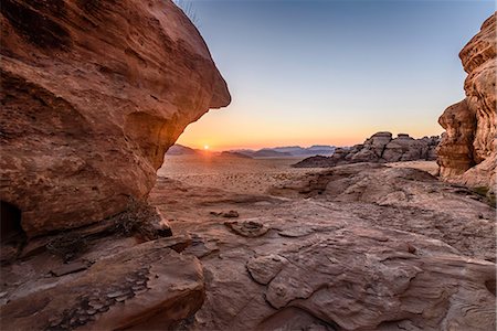 physical geography of middle east - Rock formations in the desert wilderness in southern Jordan at sunset. Stock Photo - Premium Royalty-Free, Code: 6118-09028144