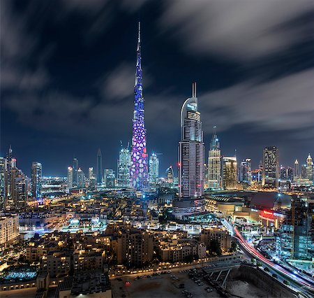 simsearch:6118-09028165,k - Cityscape of Dubai, United Arab Emirates at dusk, with the Burj Khalifa skyscraper and illuminated buildings in the centre. Stock Photo - Premium Royalty-Free, Code: 6118-09028165