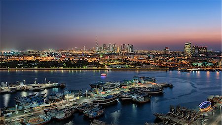 simsearch:862-07690918,k - Cityscape of Dubai, United Arab Emirates at dusk, with skyscrapers and the marina in the foreground. Stock Photo - Premium Royalty-Free, Code: 6118-09028169