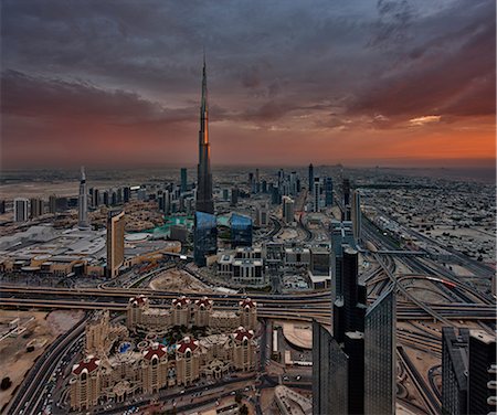 simsearch:841-03034485,k - Cityscape of Dubai, United Arab Emirates at dusk, with the Burj Khalifa skyscraper in the distance. Stock Photo - Premium Royalty-Free, Code: 6118-09028180