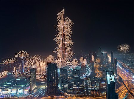 simsearch:6118-09028243,k - Cityscape of Dubai, United Arab Emirates at night, with fireworks and illuminated skyscrapers. Stock Photo - Premium Royalty-Free, Code: 6118-09028189