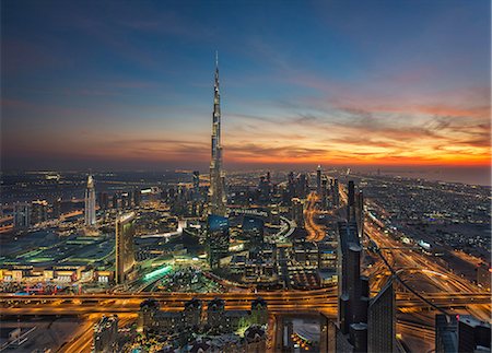 simsearch:841-03034485,k - Cityscape of Dubai, United Arab Emirates at dusk, with the Burj Khalifa skyscraper in the distance. Stock Photo - Premium Royalty-Free, Code: 6118-09028192