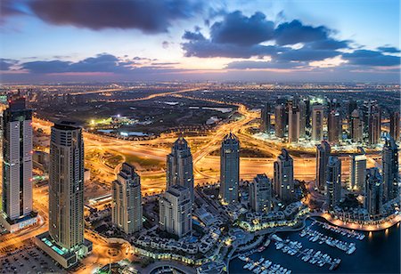 simsearch:6118-09028165,k - Aerial view of the cityscape of Dubai, United Arab Emirates at dusk, with skyscrapers and the marina in the foreground. Stock Photo - Premium Royalty-Free, Code: 6118-09028197