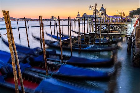 simsearch:851-02960895,k - Gondolas moored on a canal in Venice, Italy, at sunrise. Stock Photo - Premium Royalty-Free, Code: 6118-09028115