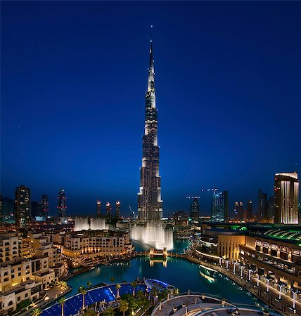 dubai marina - View of illuminated Burj Khalifa skyscraper at dusk, Dubai, United Arab Emirates. Stock Photo - Premium Royalty-Free, Code: 6118-09028244