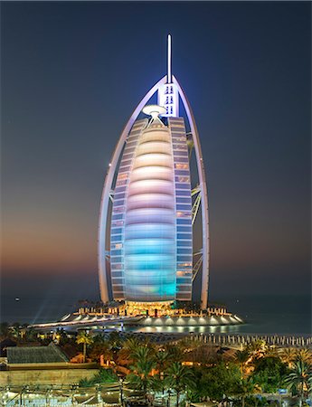 simsearch:649-08632842,k - View of illuminated Burj Al Arab skyscraper in Dubai, United Arab Emirates at dusk. Stock Photo - Premium Royalty-Free, Code: 6118-09028254