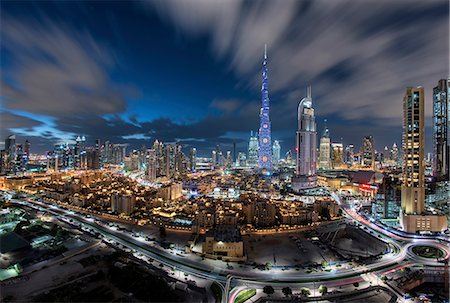 simsearch:841-03034485,k - Cityscape of Dubai, United Arab Emirates at dusk, with illuminated Burj Khalifa skyscraper in the centre. Stock Photo - Premium Royalty-Free, Code: 6118-09028203