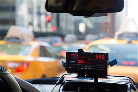 dashboard in car - Vehicle interior of New York yellow cab, close up of meter running. Stock Photo - Premium Royalty-Free, Code: 6118-09144975