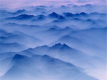 dreamy and nobody - Aerial view of mountain range covered in mist at twilight. Stock Photo - Premium Royalty-Free, Code: 6118-09144989