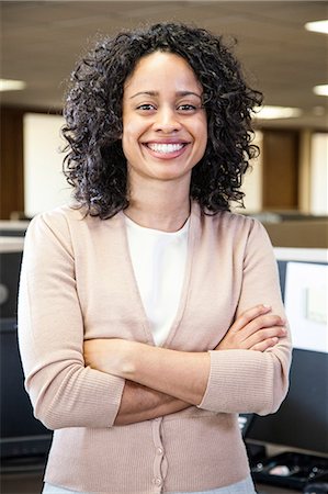 simsearch:6118-09147986,k - Portrait of a black businesswoman in her office. Fotografie stock - Premium Royalty-Free, Codice: 6118-09148025