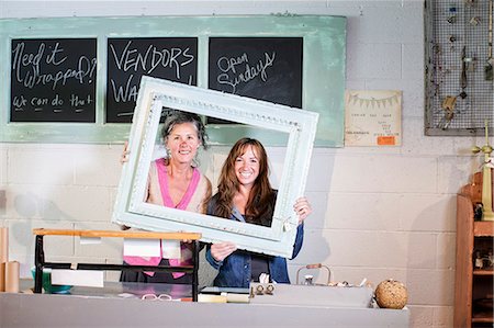 Two Caucasian women owners of an antique store. Stock Photo - Premium Royalty-Free, Code: 6118-09148030