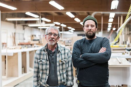 simsearch:6118-08729048,k - Portrait of two Caucasian carpenters in a large woodworking factory. Photographie de stock - Premium Libres de Droits, Code: 6118-09165988