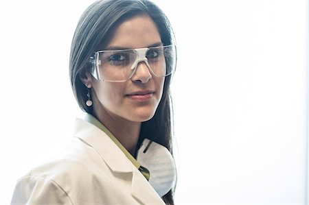 Portrait of a Hispanic female dentist in her office. Stock Photo - Premium Royalty-Free, Code: 6118-09166136