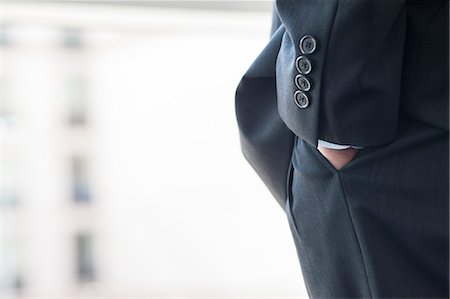 simsearch:6118-09173536,k - Close-up of a businessman's hand in a suit pants pocket. Stockbilder - Premium RF Lizenzfrei, Bildnummer: 6118-09173524